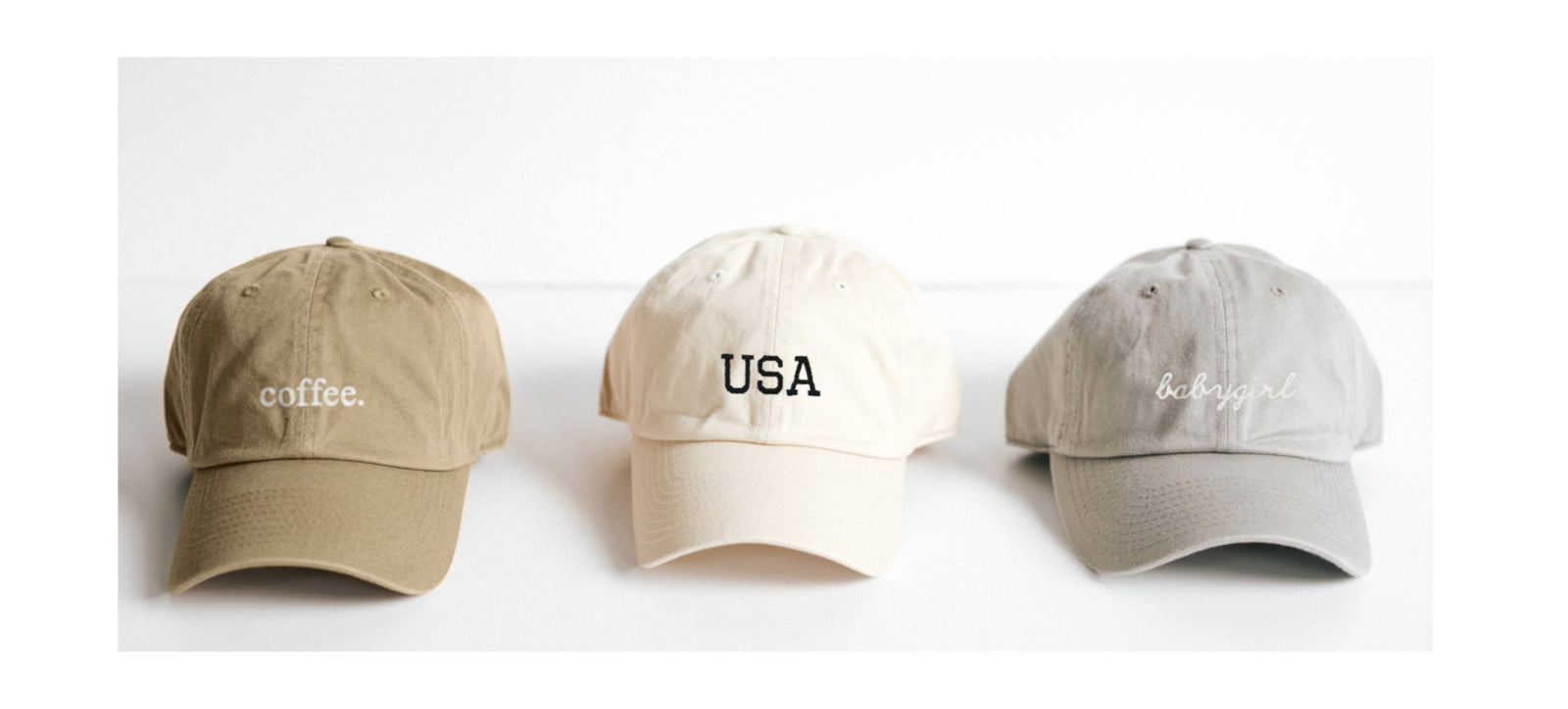 three baseball hats with embroidery